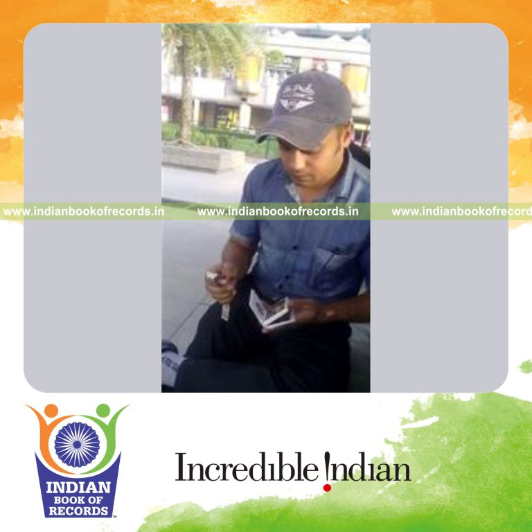 individual performing one handed triple card cuts in 30 seconds for record in Indian Book of Records
