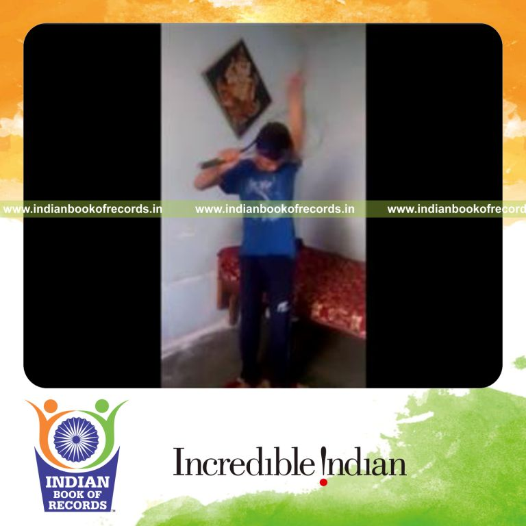 individual passing stringless tennis racquet over body repeatedly in one minute for record in Indian Book of Records