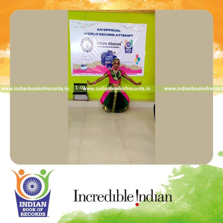 individual female solving single digit addition problems while performing classical dance simultaneously for record in Indian Book of Records