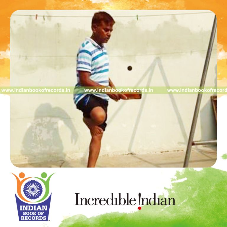 individual bouncing squash ball on beer bottle while standing on one leg for record in Indian Book of Records