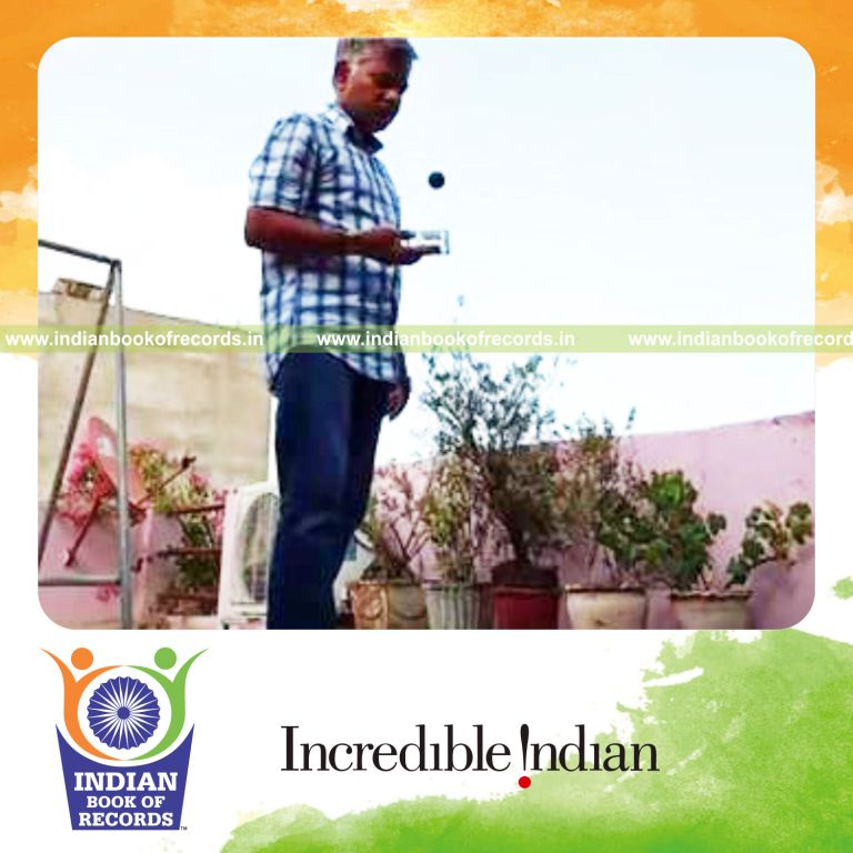 individual bouncing squash ball on miniature wine bottle for record in Indian Book of Records