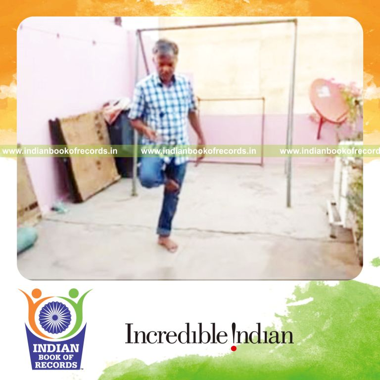 individual bouncing squash ball on miniature wine bottle while standing on one leg for record in Indian Book of Records