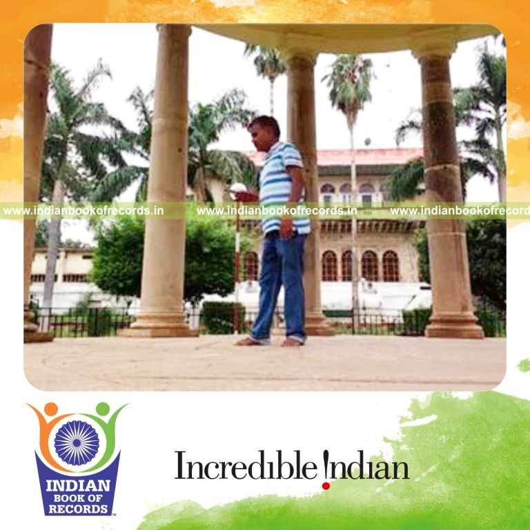 individual bouncing squash ball on table tennis paddle handle for record in Indian Book of Records
