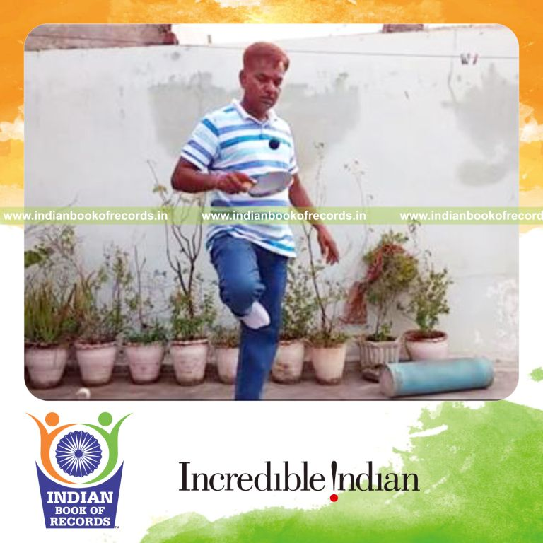 individual bouncing squash ball on paddle while standing on one leg for record in Indian Book of Records