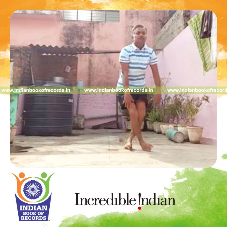 individual standing up with legs crossed repeatedly in one minute for record in Indian Book of Records