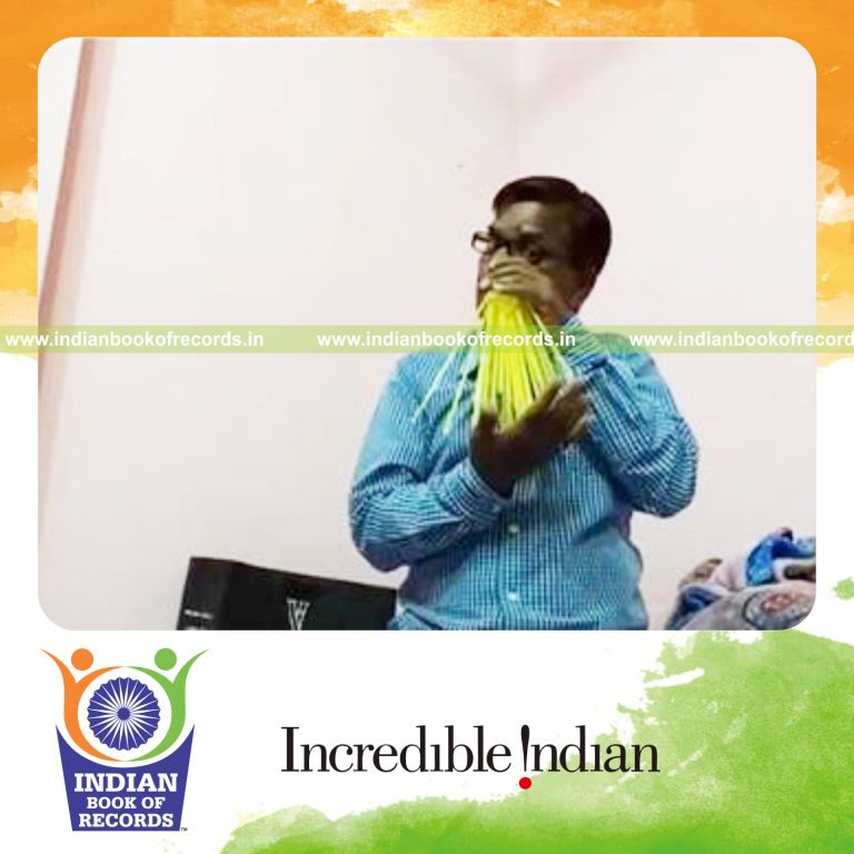 individual fitting maximum straws into nostrils for record in Indian Book of Records
