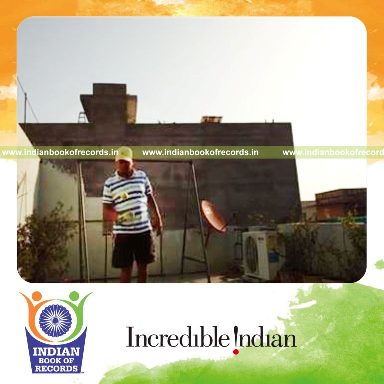 individual bouncing tennis ball on empty wine bottle for record in Indian Book of Records