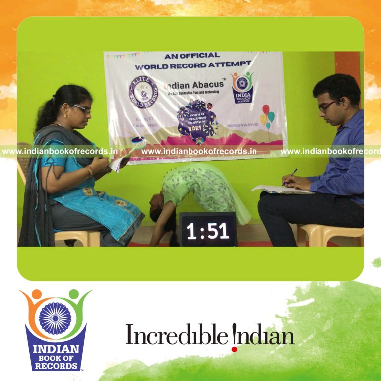 individual female solving three digit multiplication problems while performing yoga simultaneously for record in Indian Book of Records