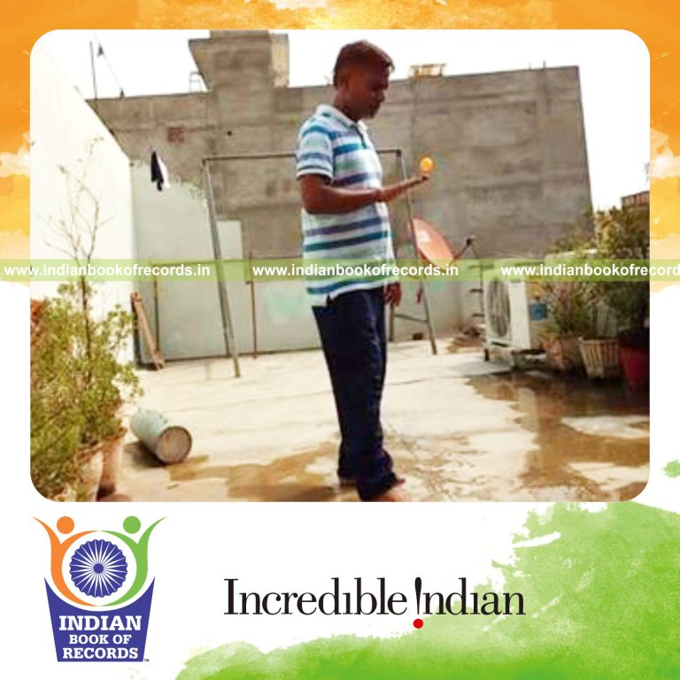 individual bouncing table tennis ball on back of hand for record in Indian Book of Records