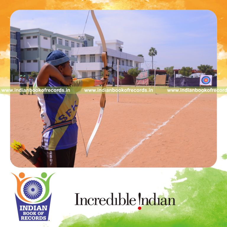 young girl performing archery shots at target for Indian Book of Records