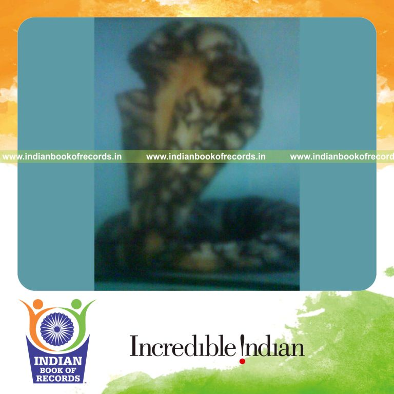 male individual carving artifacts from areca nut for record in Indian Book of Records