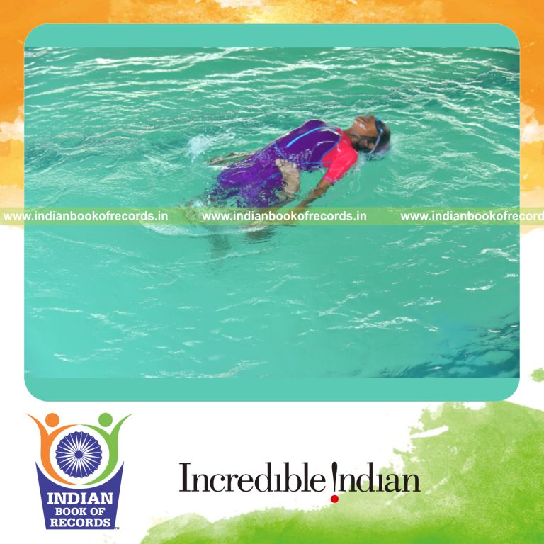 individual minor female performing maximum back flips in water in 3 minutes for record in Indian Book of Records