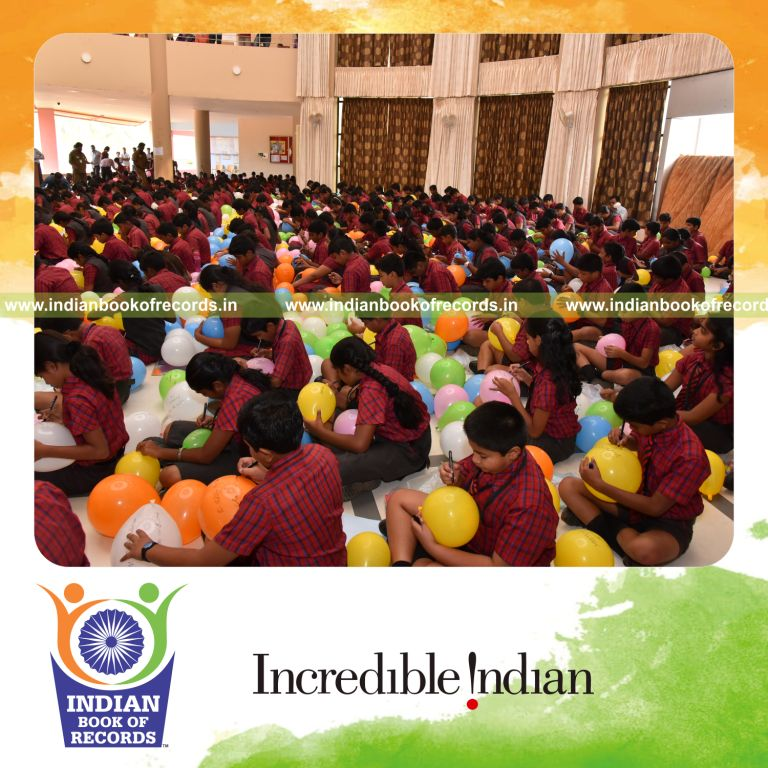 team blowing balloons and writing captions quickly for Indian Book of Records