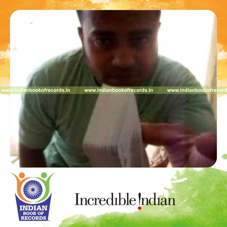 individual performing maximum behind back muse card cuts in one minute for record in Indian Book of Records