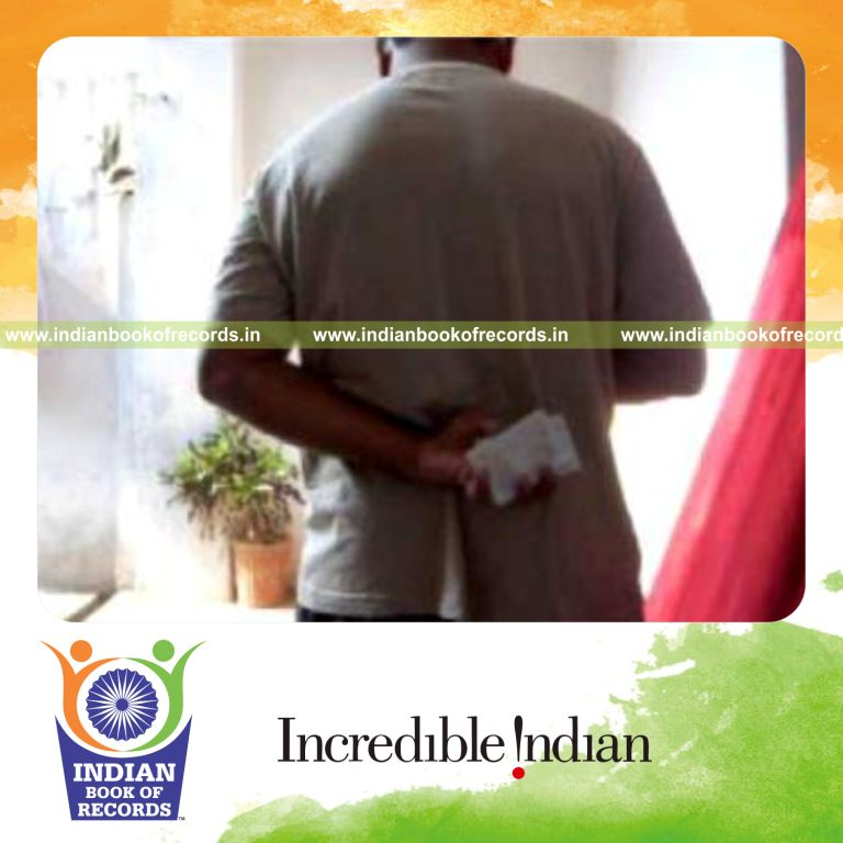 individual performing maximum behind back reverse scissor cuts in one minute for record in Indian Book of Records