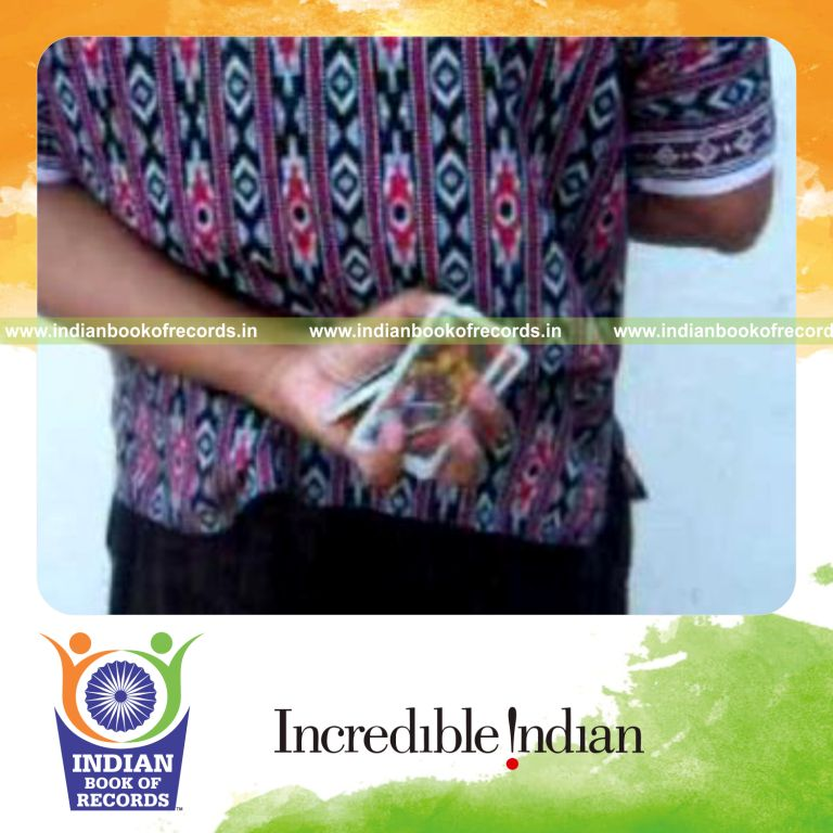 individual performing maximum behind back three packet thumb cuts in 30 seconds for record in Indian Book of Records