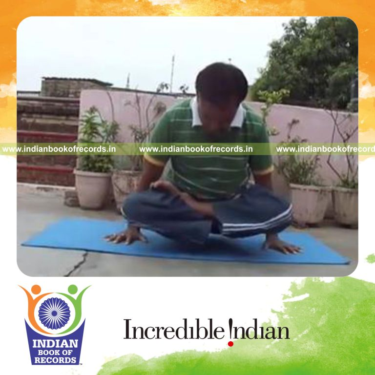 individual swinging body while holding lotus pose for record in Indian Book of Records