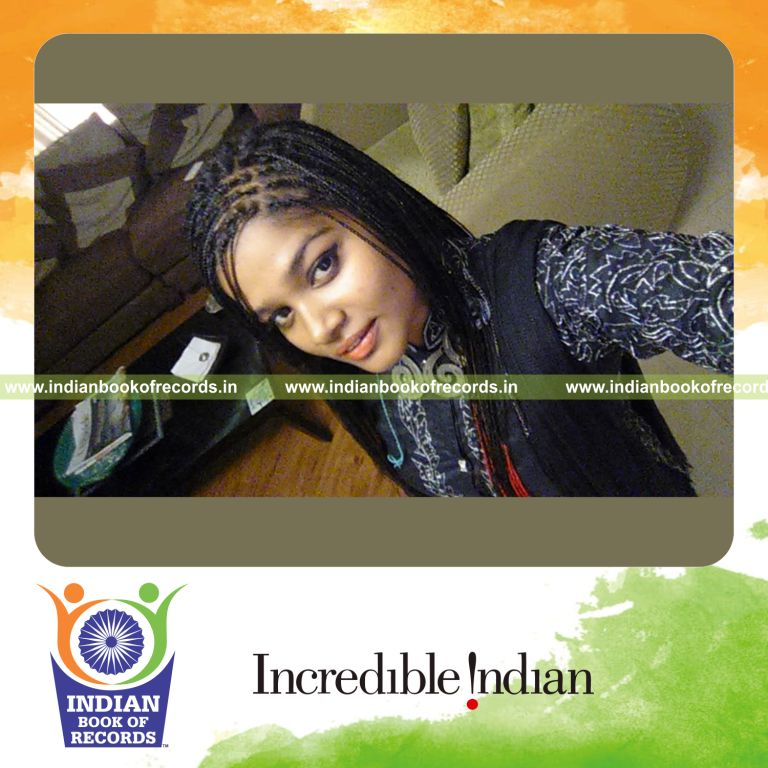 female creating box braids hairstyle on long hair for Indian Book of Records
