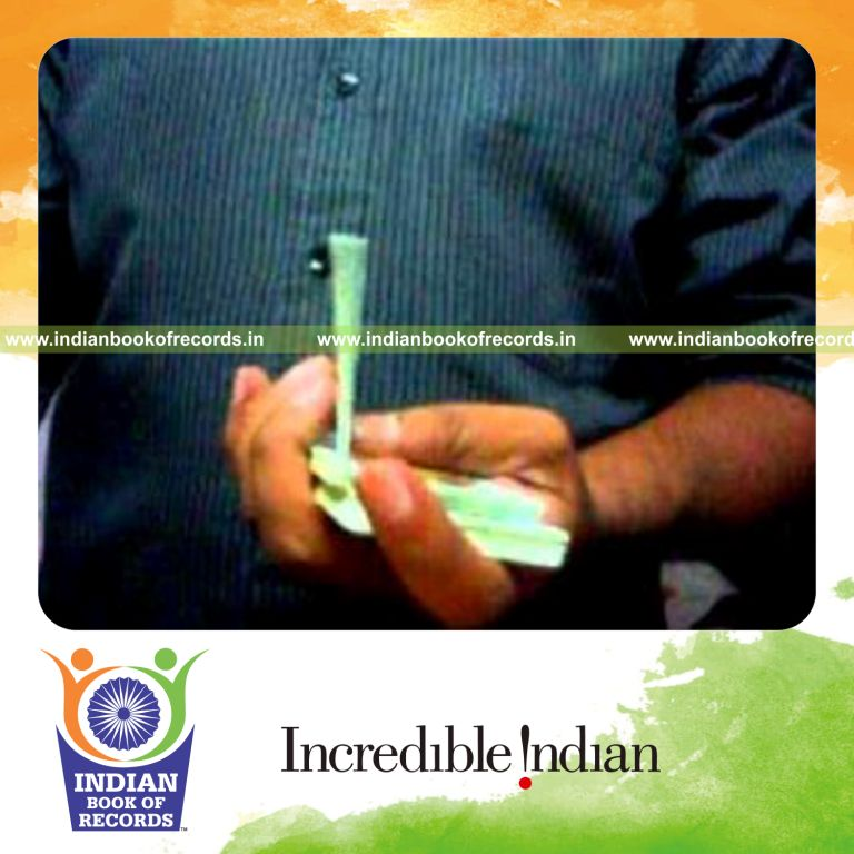 individual performing maximum brian twist card cuts in 30 seconds for record in Indian Book of Records