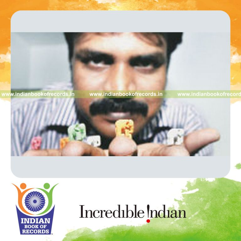 male individual creating multiple chalk sculptures for record in Indian Book of Records