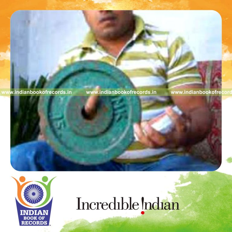 individual performing charlier card cuts in one minute while holding weight plate for record in Indian Book of Records