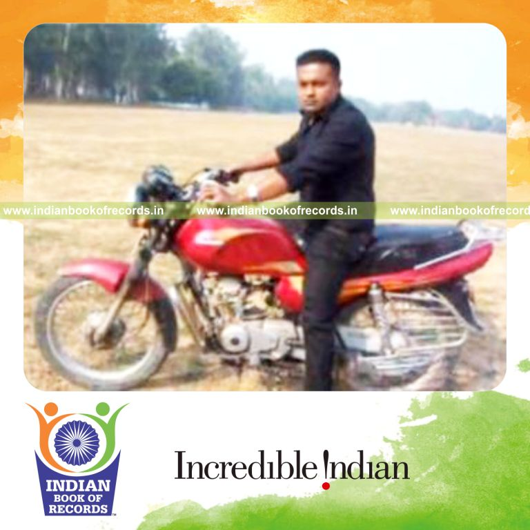 individual performing maximum charlier cuts while riding motorcycle for record in Indian Book of Records