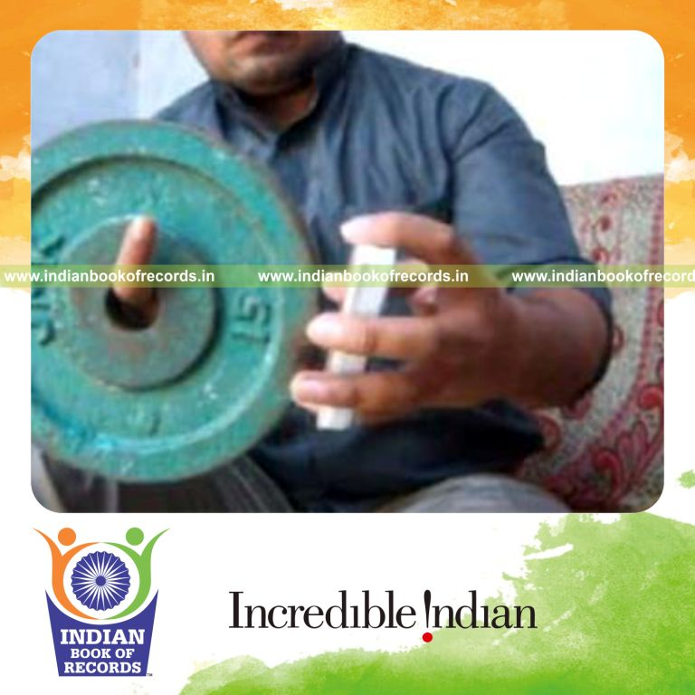 individual performing chen ka card cuts in one minute while holding weight plate for record in Indian Book of Records