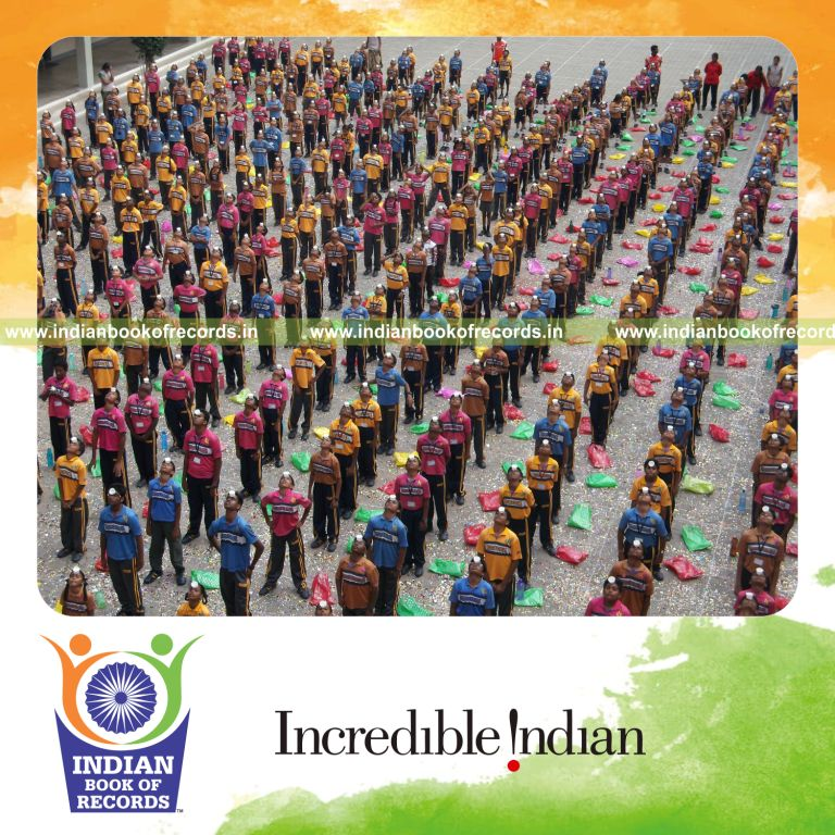 children balancing paper cups on forehead simultaneously for Indian Book of Records