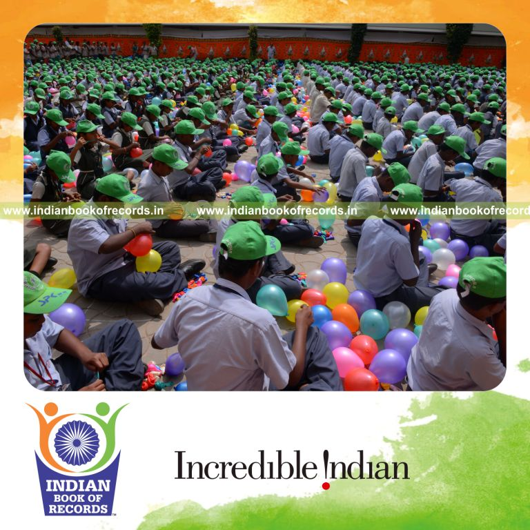 children blowing and bursting balloons simultaneously for Indian Book of Records