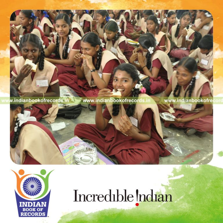 children eating hazelnut cocoa bread simultaneously during Indian Book of Records event