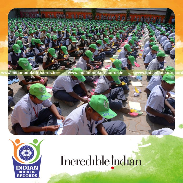 children making paper boats simultaneously at single venue for Indian Book of Records