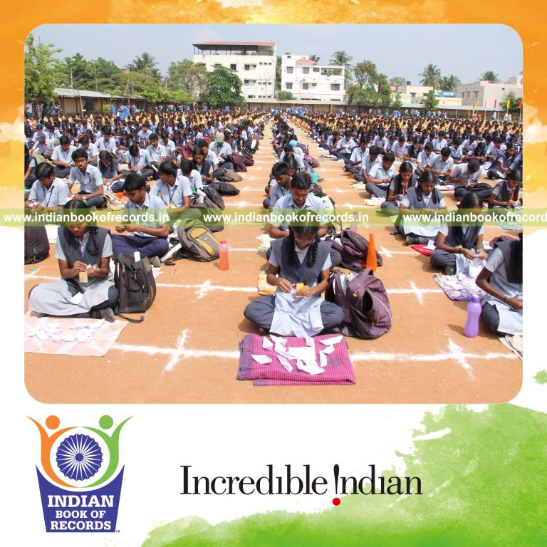 children making paper boats simultaneously for Indian Book of Records