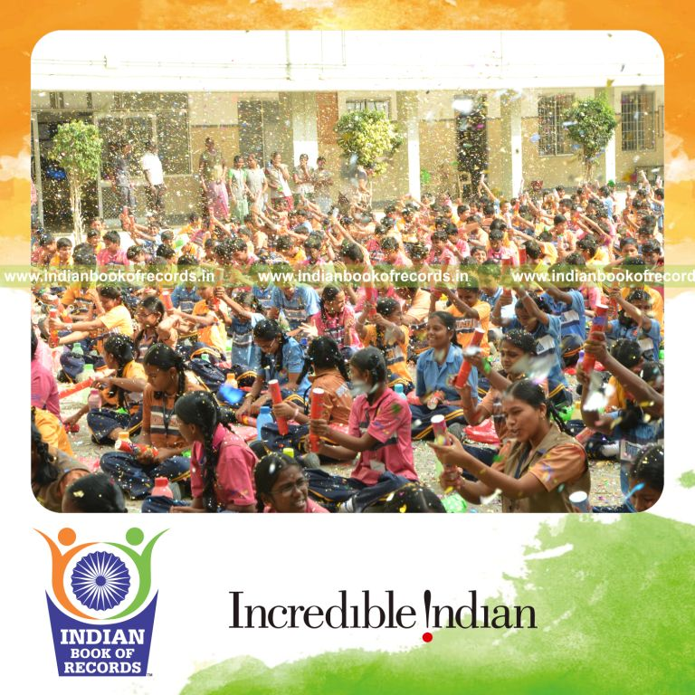 children bursting party poppers simultaneously for Indian Book of Records