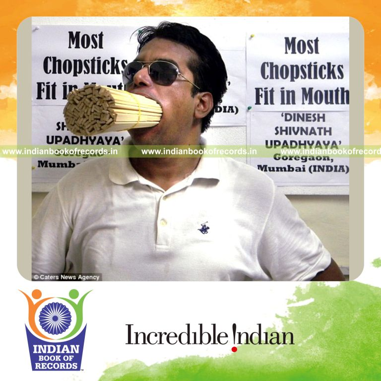 individual stuffing chopsticks in mouth for Indian Book of Records