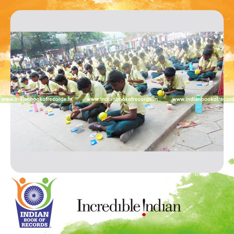team painting clay pots simultaneously at single venue for Indian Book of Records