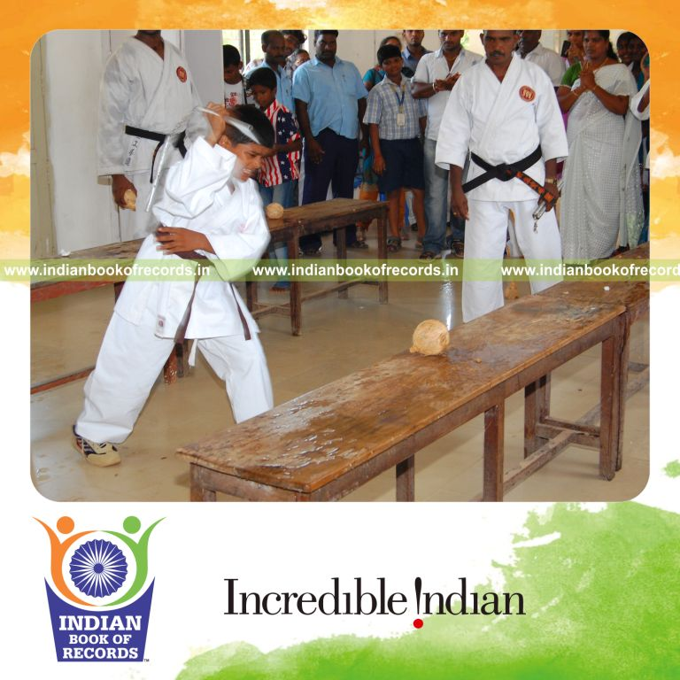 young male breaking coconuts using nunchaku within thirty minutes for record in Indian Book of Records