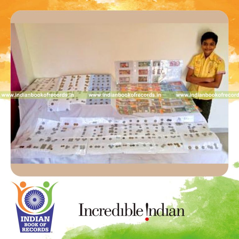young collector displaying commemorative coins collection for Indian Book of Records