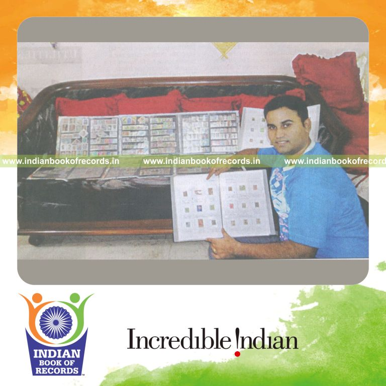 stamp collector showcasing large collection of country stamps for Indian Book of Records