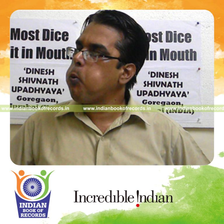 individual stuffing dices in mouth for Indian Book of Records