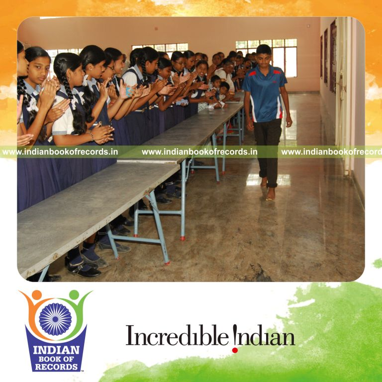 male individual walking using toe phalanges over distance for record in Indian Book of Records