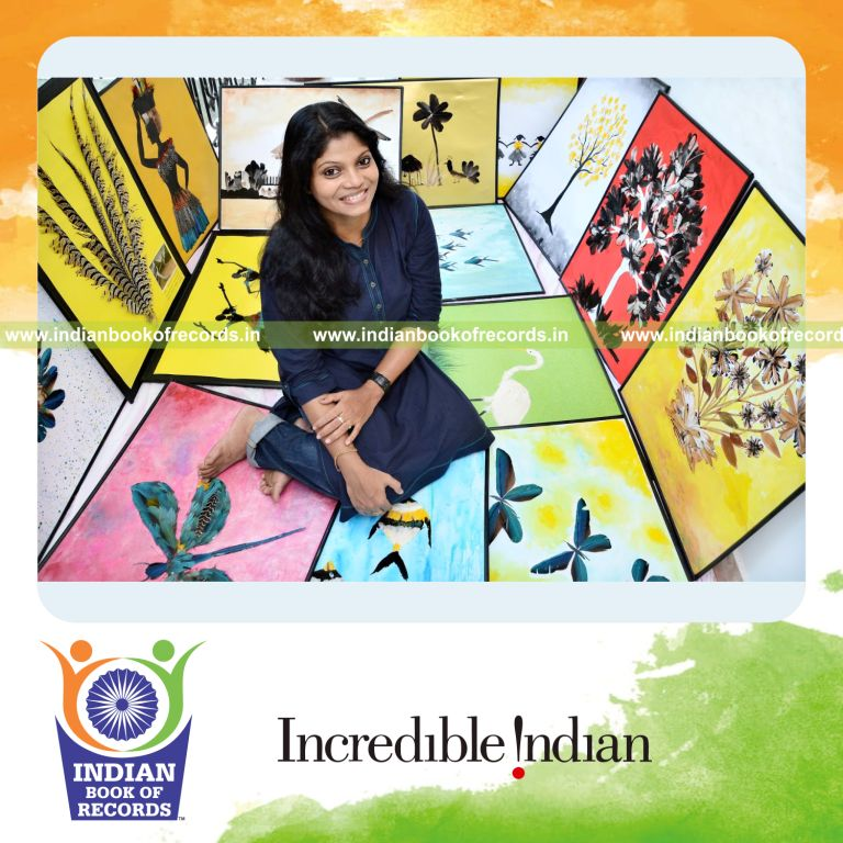 collection of feathers displayed by individual for Indian Book of Records