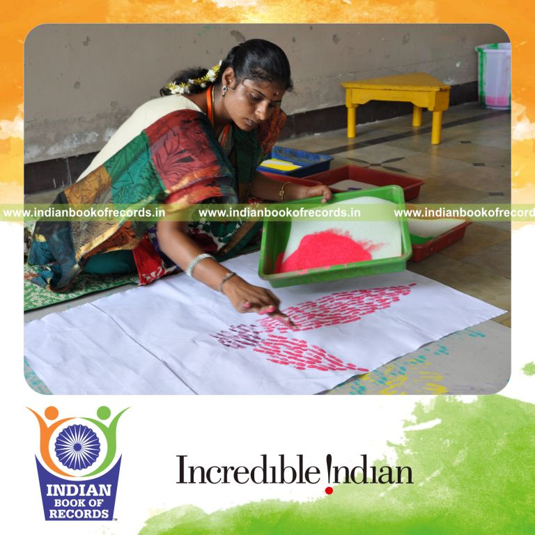 female individual creating finger paintings within ten hours for record in Indian Book of Records