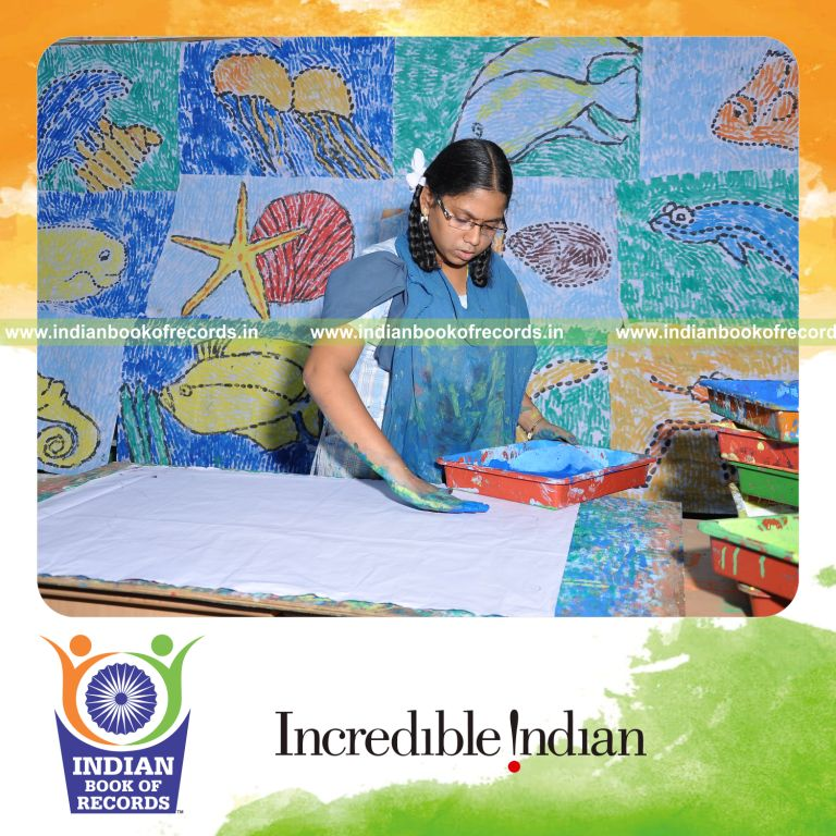 young female creating finger paintings within six hours for record in Indian Book of Records