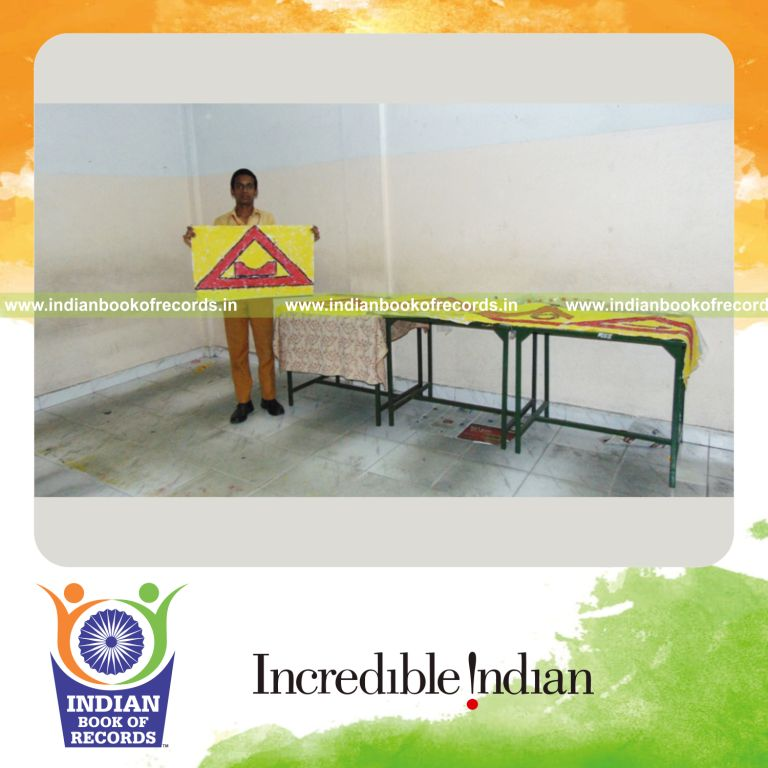 minor male creating multiple finger paintings for Indian Book of Records