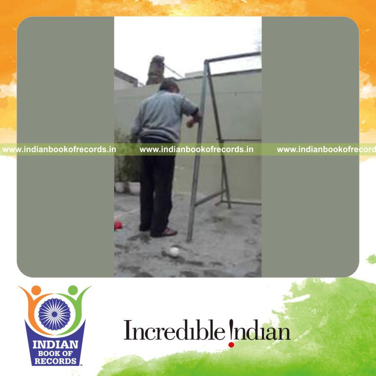 individual performing forearm strikes on iron pipe for record in Indian Book of Records