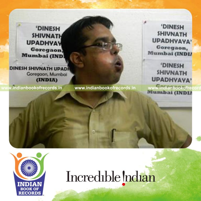 individual stuffing glass marbles in mouth for Indian Book of Records