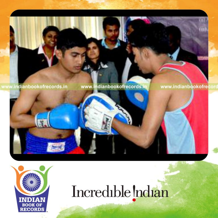 male individual performing multiple hits on punching pad within one minute for record in Indian Book of Records