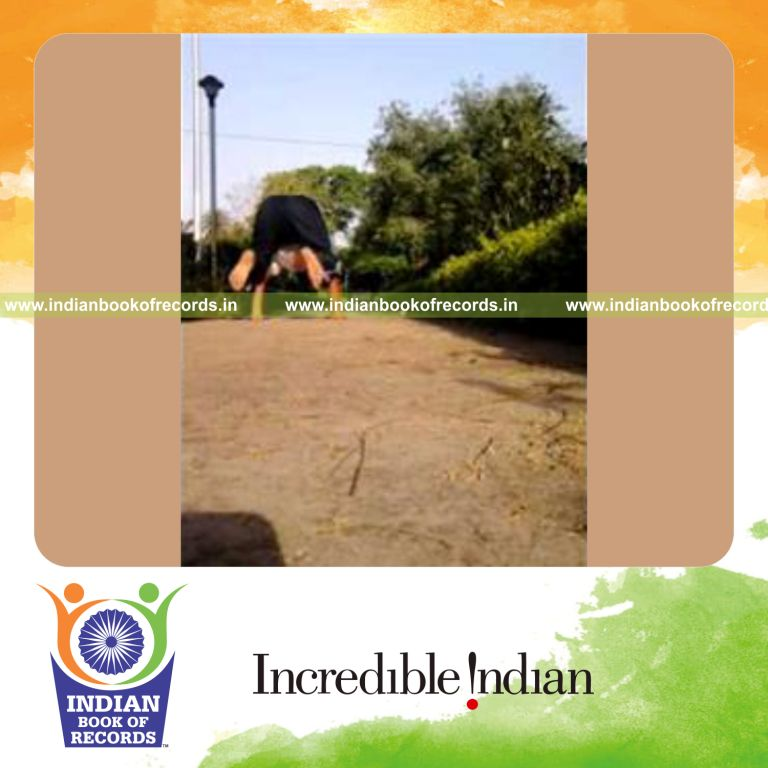 individual spreading legs while holding crow pose for record in Indian Book of Records