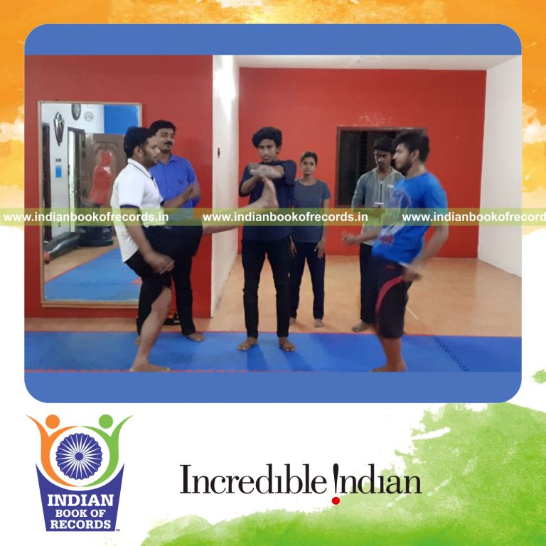 a pair performing martial arts kicks continuously within one minute for a record in Indian Book of Records
