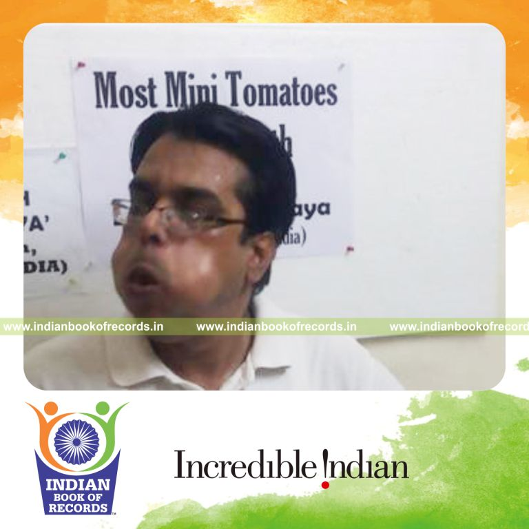 individual fitting maximum mini tomatoes in mouth for record in Indian Book of Records